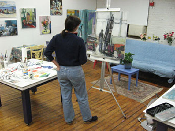 Emily painting in her studio